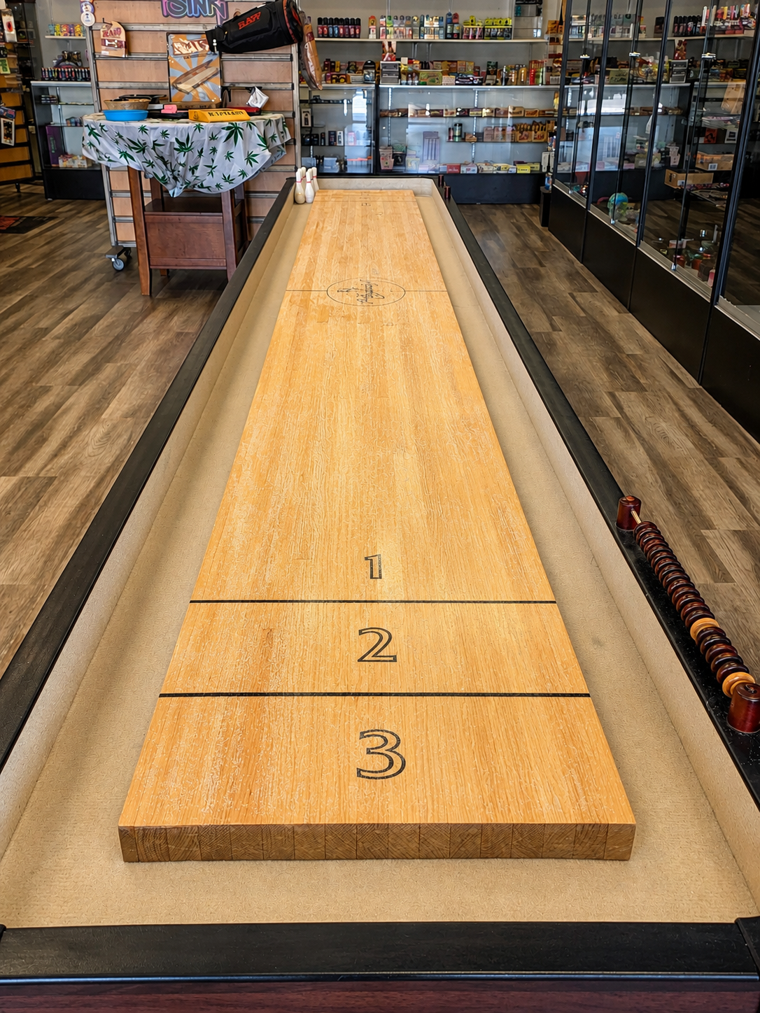 Shuffleboard table inside Smoke World